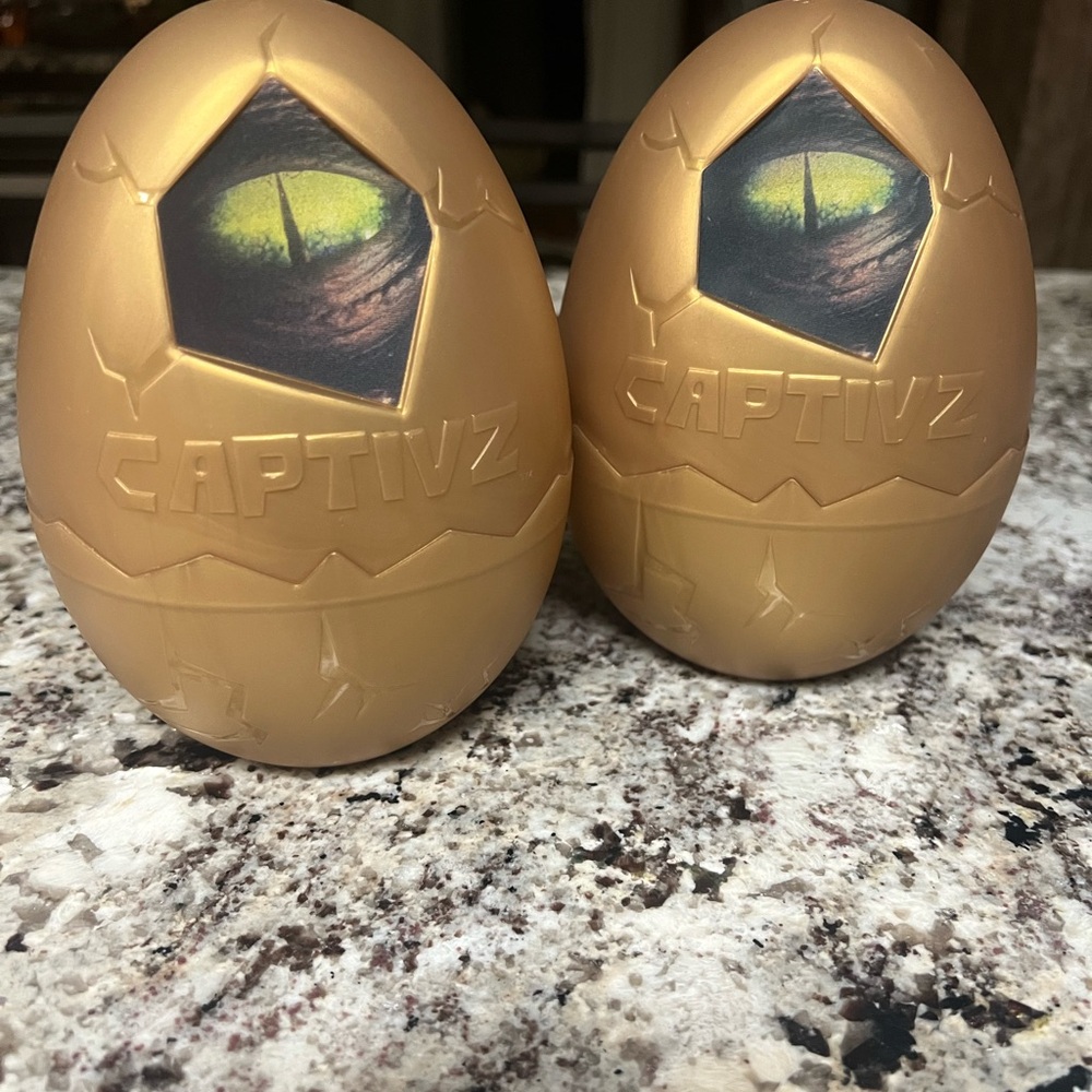 2 Gold Captivz Dinosaur Eggs